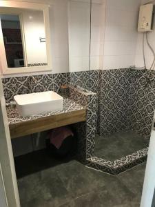 a bathroom with a sink and a mirror at 420 Canopy Studio Meals Included in Chiang Mai