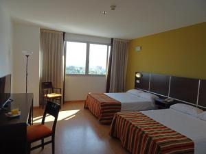 Cama o camas de una habitación en La Estación