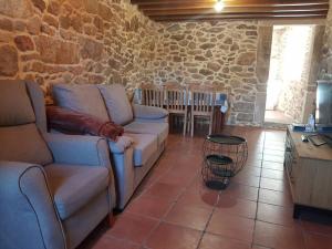 Posezení v ubytování VibesMuxía- Casa Rural Castelo + 4 fotografie
