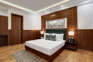 Letto o letti in una camera di Lemon Tree Hotel, Mcleodganj