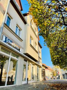 a building on the side of a street at Ferienwohnungen Anne in Schönebeck