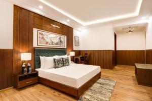 Letto o letti in una camera di Lemon Tree Hotel, Mcleodganj