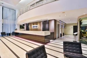 a bowling alley with a ball court in a lobby at King room - Brooklin flat in São Paulo