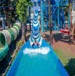 a person in a water slide at a water park at Visava Amusement Park & Resort Navi Mumbai in Navi Mumbai