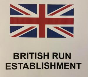 a sign for a british run establishment with the british run emblem at Villa Alta in Villalba