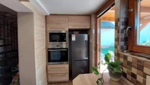 Kuchyň nebo kuchyňský kout v ubytování Újhegy Apartman