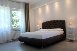 Postel nebo postele na pokoji v ubytování Villa Forte Salvi - Rooms