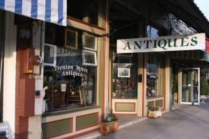a store front of an antiques store on a street at Residence Inn by Marriott Monroe in Monroe