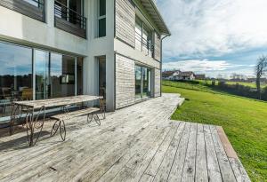 a wooden deck with a bench on top of a house at VILLA ARCANGUES in Arcangues