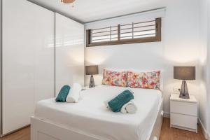 Ένα ή περισσότερα κρεβάτια σε δωμάτιο στο SUMMERLAND LUXURY APARTMENT lN LOS CRISTIANOS +16 φωτογραφίες