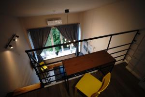 a room with a table and chairs and a window at AJ Chocolate Vilnius in Vilnius