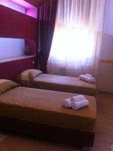 Postel nebo postele na pokoji v ubytování B&B The Queens