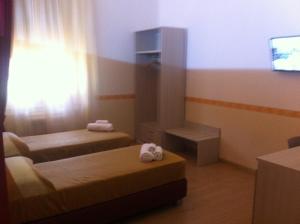 TV a/nebo společenská místnost v ubytování B&B The Queens