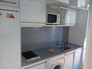Kuchyň nebo kuchyňský kout v ubytování Apartamentos Turísticos Los Ángeles + 35 fotografií