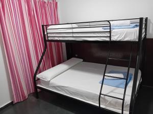 Postel nebo postele na pokoji v ubytování Apartamentos Turísticos Los Ángeles