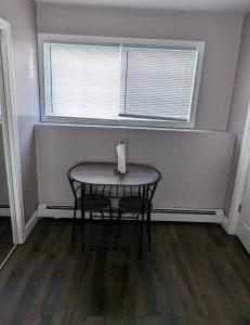 a small table in a room with a window at Private room and bathroom in Providence