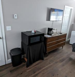 a room with a desk and a dresser with a desk at Private room and bathroom in Providence