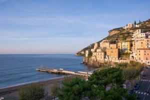 a view of a beach with buildings and the ocean at Villa Isabella in Minori