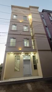 a building with a door in front of it at Continental Boys Hostel R-2 Johar Town in Lahore