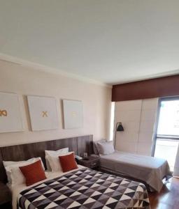 Postel nebo postele na pokoji v ubytování Hotel Paulista Plaza MCR