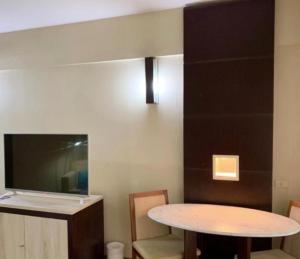 TV a/nebo společenská místnost v ubytování Hotel Paulista Plaza MCR