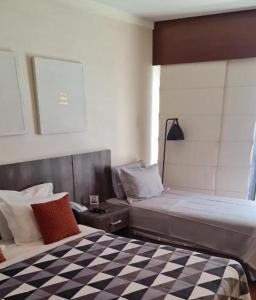 Postel nebo postele na pokoji v ubytování Hotel Paulista Plaza MCR