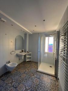 a bathroom with a toilet and a sink and a shower at Willa Koniaków in Koniaków