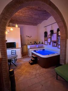 a large room with a large tub in a kitchen at Relax nella jacuzzi in Toscana in Colle di Val d'Elsa +17 photos