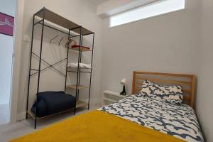 a bedroom with a bed and a closet at Apartamento Torre de Hércules in A Coruña