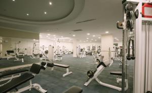 a gym with several treadmills and machines at Burgaz İzer Hotel in Lüleburgaz