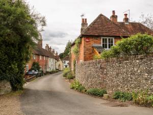 an empty street in a village with brick houses at Hapton Folly in Waterlooville