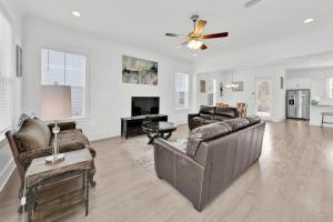 a living room with a couch and a table at Grande Pointe Sea Shell in Inlet Beach
