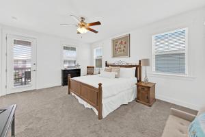 a bedroom with a bed and a ceiling fan at Grande Pointe Sea Shell in Inlet Beach +44 photos