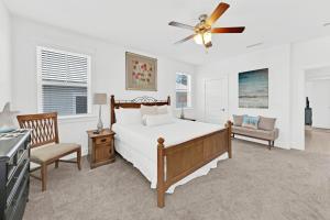 a bedroom with a bed and a ceiling fan at Grande Pointe Sea Shell in Inlet Beach