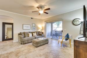 a living room with a couch and a ceiling fan at Walk to Papago Park Central Phoenix Condo in Phoenix