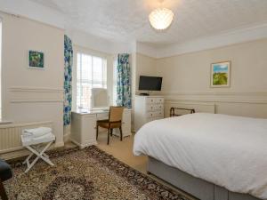 En eller flere senge i et værelse på Apple Tree House