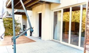 a large glass door of a building with at Le Safran in Obernai