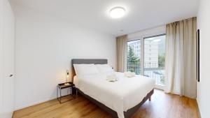 Postel nebo postele na pokoji v ubytování Bright & modern apartments in Sion