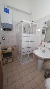 a bathroom with a shower and a sink at Monolocale Azzurra in Magione