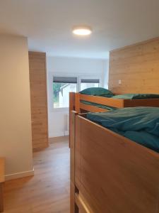 Ένα ή περισσότερα κρεβάτια σε δωμάτιο στο Chalet Jaune Charmant SOM
