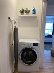 a washer and dryer in a room at Flat 1 in Lampeter