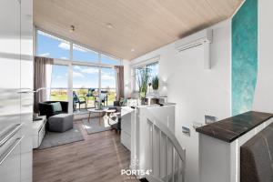 Køkken eller tekøkken på Ferienhaus Ankerplatz Marina Wendtorf