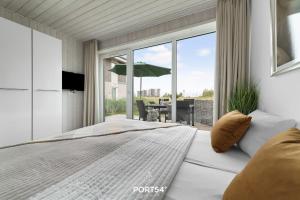Postel nebo postele na pokoji v ubytování Ferienhaus Nordlicht Marina Wendtorf