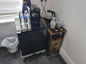 a small table with water bottles on top of it at Rendezvous Bar & Rooms - ADULTS ONLY in Blackpool