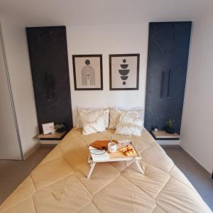 a large bed with a table on top of it at Alojamientos Cordoba - Cañada in Córdoba