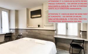 Łóżko lub łóżka w pokoju w obiekcie Guesthouse Foresteria Margherita Milano