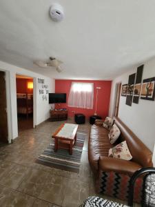 a living room with a couch and a coffee table at RyG Apartments in San Carlos de Bariloche