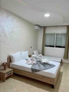 Una cama o camas en una habitación de Appartement haut standing 3 chambres avec Terasse quartier Gueliz / Hivernage à Marrakech