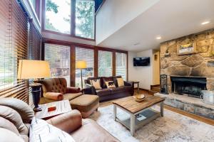 a large living room with a stone fireplace at Buckberry Creek Unit 1 in Gatlinburg