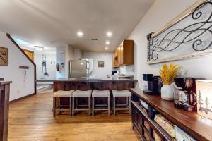 a kitchen with a counter with bar stools in it at Buckberry Creek Unit 1 in Gatlinburg